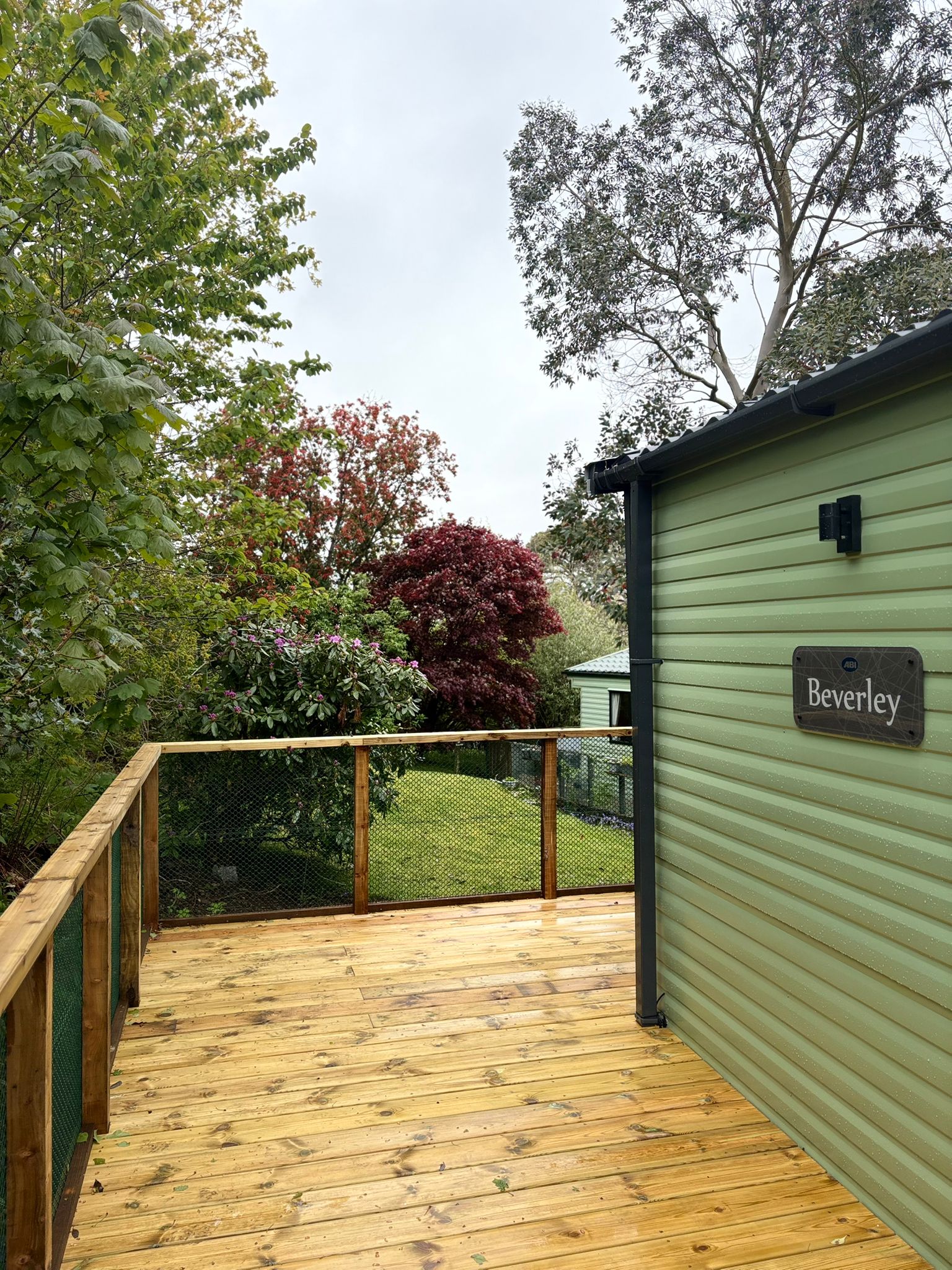 A deck surrounded in greenery